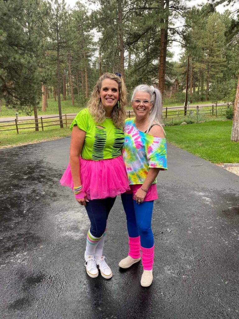 2 women in costumes that they wore to a exercise themed party